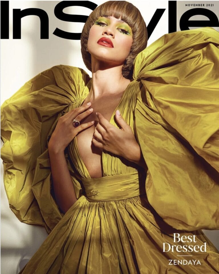 Zendaya: Wears a vibrant yellow dress with voluminous sleeves and a deep neckline that highlights…