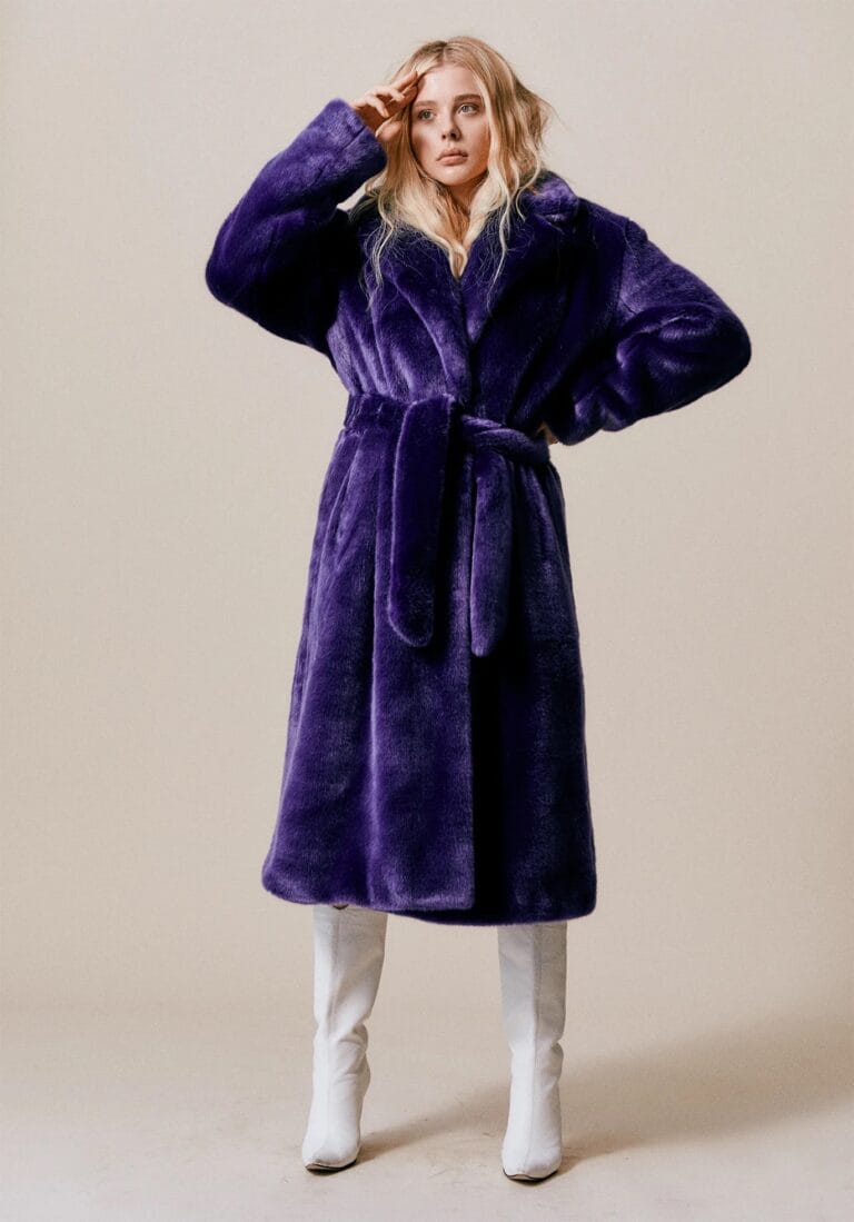Chloë Grace Moretz: Wears a roomy, wrap-style purple faux fur coat with a belt that accentuates…