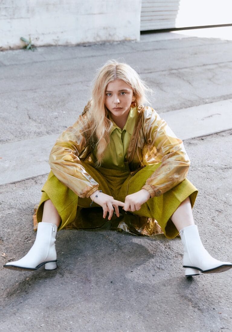 Chloë Grace Moretz: Wears a bold outfit with a bright green shirt and wide-leg pants…