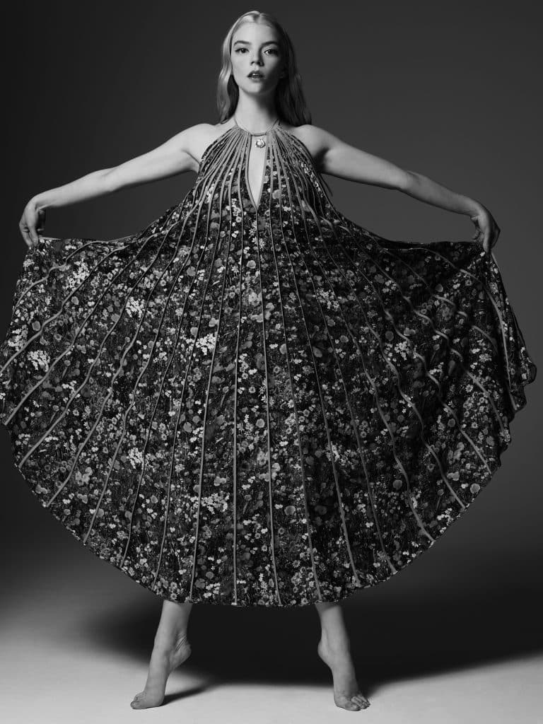 Anya Taylor-Joy: The dress is long and has a floral print, with a halter neckline…