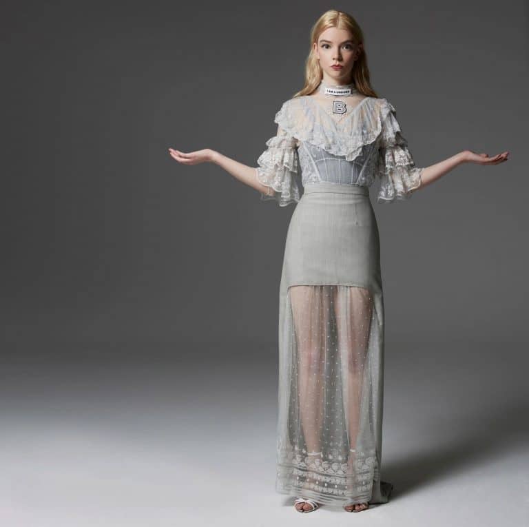 Anya Taylor-Joy: Wears an elegant light-colored dress with a lace blouse and sleeves…