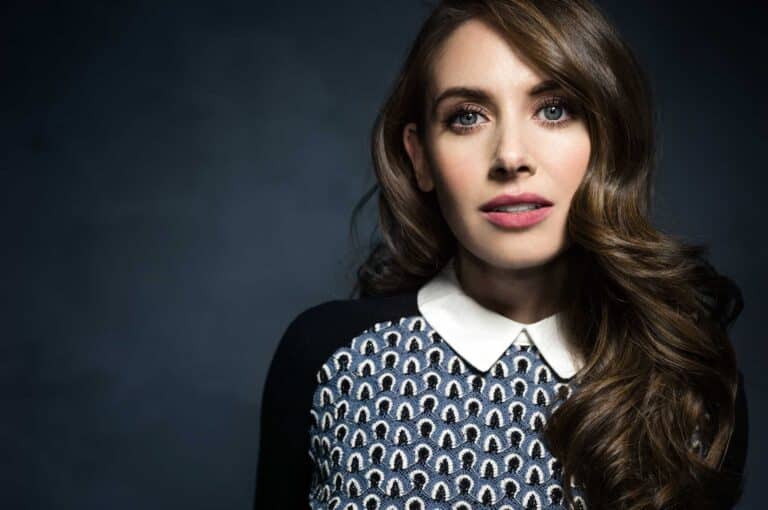 Alison Brie: Wears a blue and white patterned sweater with a white buttoned collar…