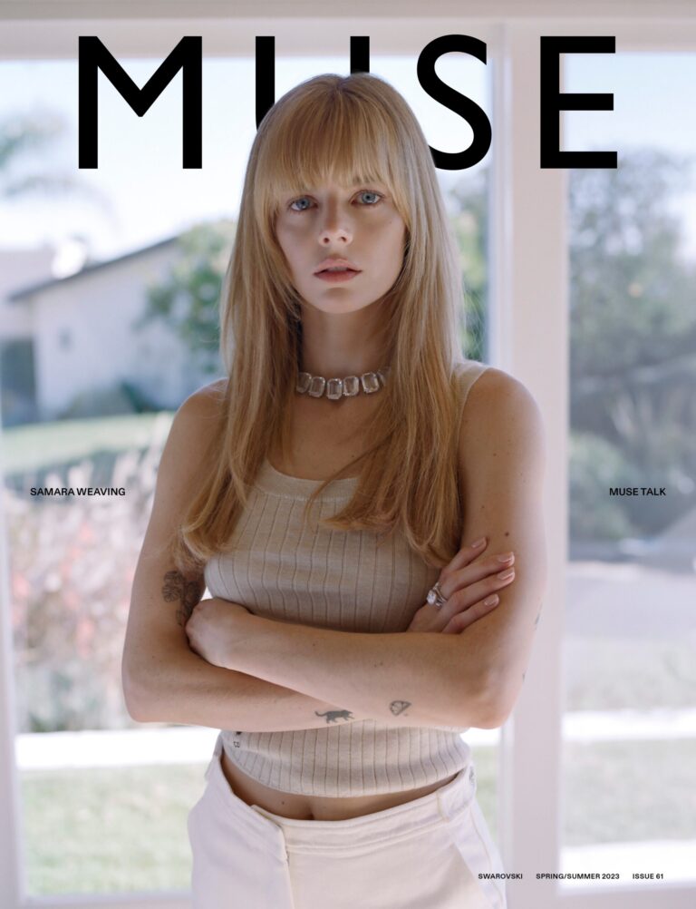 Samara Weaving: Wears a light beige sleeveless top and white pants. Wears a…
