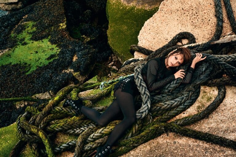 Alicia Vikander: Lying among thick, moss-covered ship ropes, wearing a black outfit with mesh&hellip;