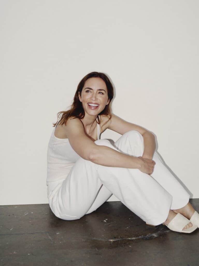 Emily Blunt: Wearing a sleeveless top and white pants. Wearing open sandals in the same…