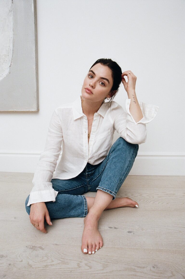 Lucy Hale: Rocks a white long-sleeve shirt and blue jeans. Barefoot, with her…