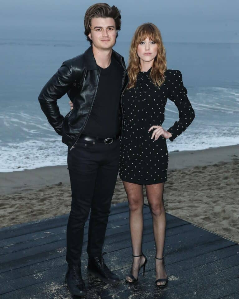 Maika Monroe: On a platform by the beach, a person wearing a leather jacket…