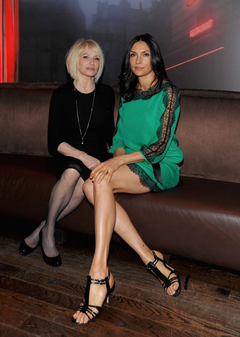 Famke Janssen: One wears a tight black dress with fishnet tights and high-heeled shoes…
