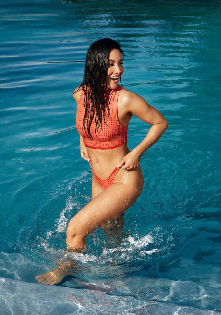 Olivia Munn: Rocks a red bikini while enjoying the pool. No shoes. The water…