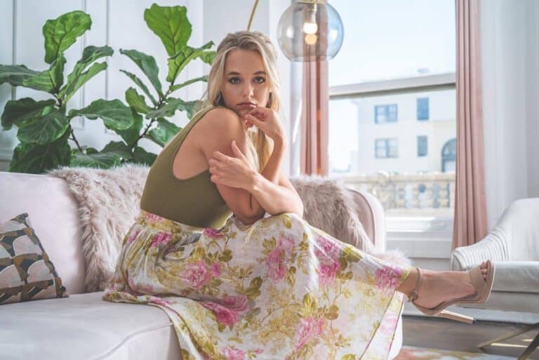 Madison Iseman: Wears an olive-green top and a long floral skirt in tones…