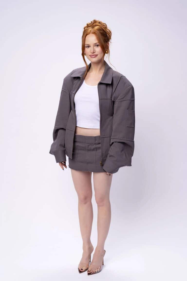 Madelaine Petsch: Rocks a modern look with an oversized gray jacket and a matching miniskirt,…