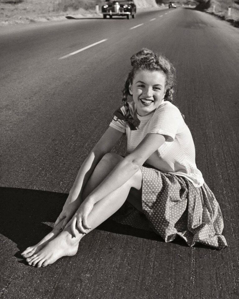 Marilyn Monroe: Smiling in the sun, dressed in a light T-shirt and a polka-dot skirt,…