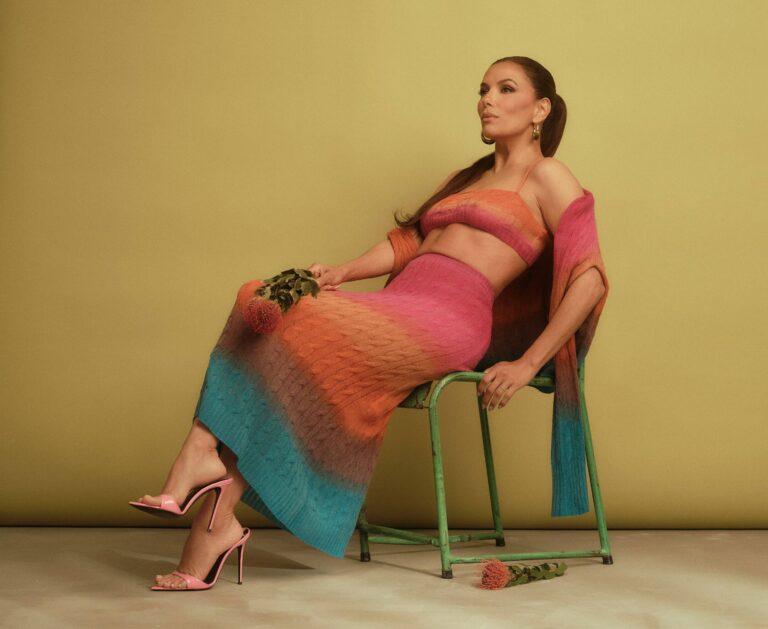 Eva Longoria: Wears a knit set in pink, orange and blue ombré tones, made up…