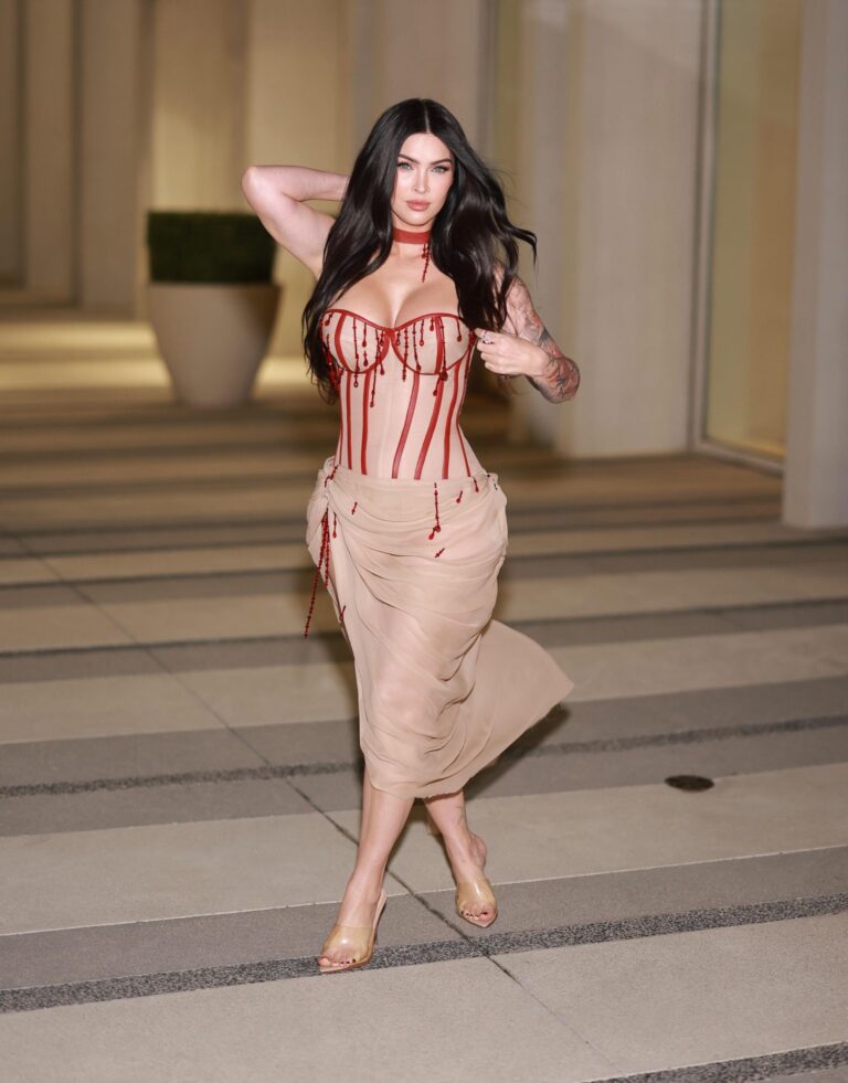 Megan Fox: Wears a fitted nude dress with red details that stand out on the…