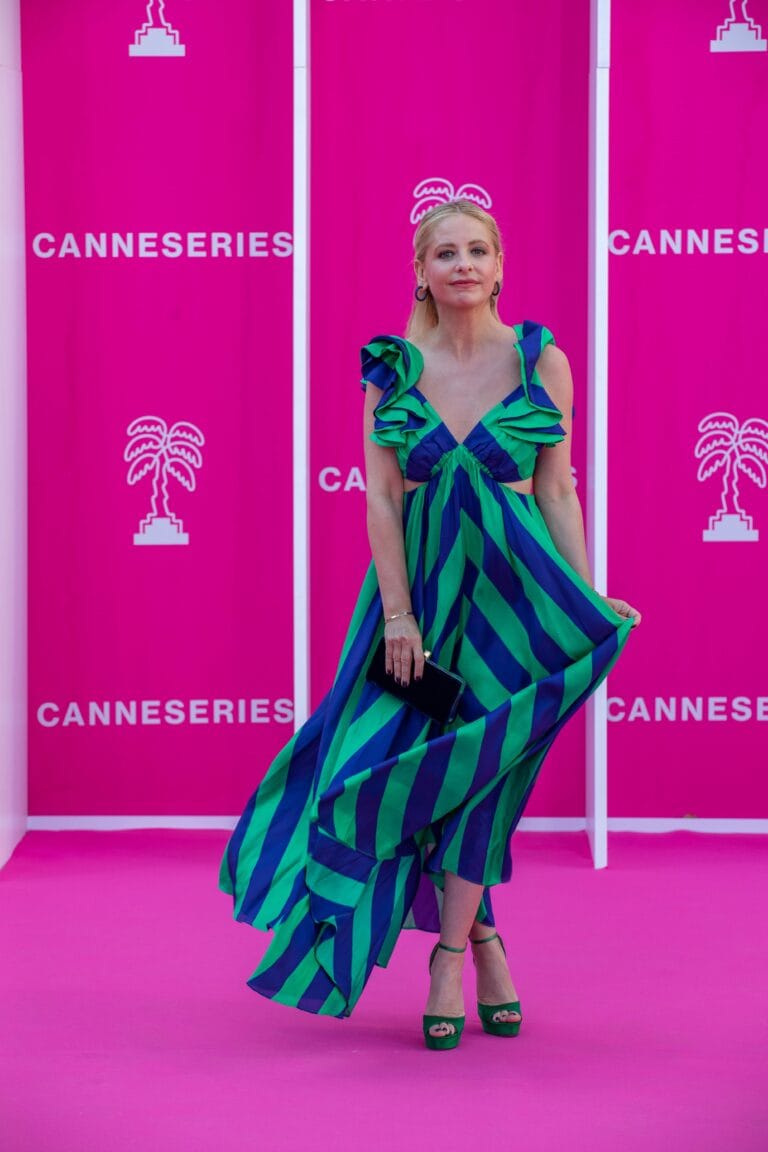 Sarah Michelle Gellar: In a long green and blue striped dress with ruffled shoulders…