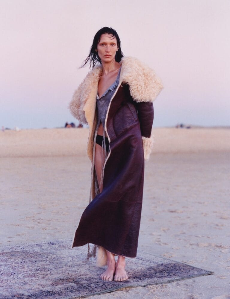 Bella Hadid: A long coat with a wool lining over a light outfit. Barefoot on…