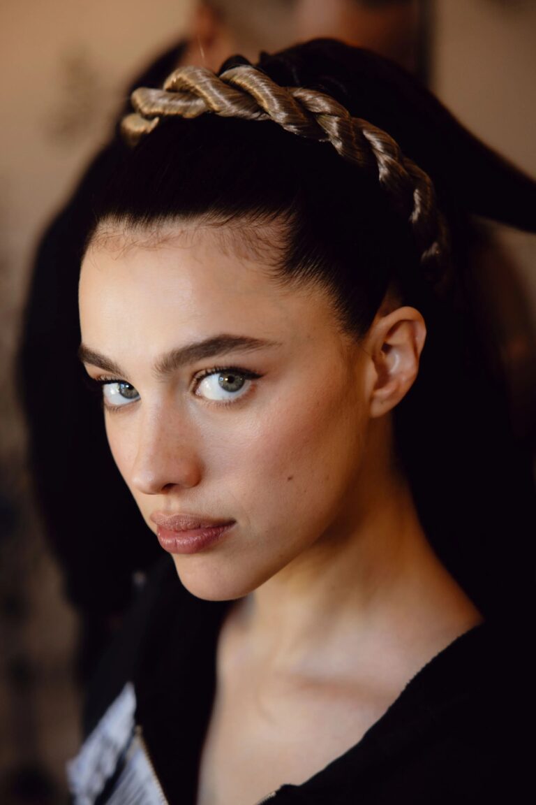 Margaret Qualley: Hair pulled back in a braided headband style, smooth skin and an intense gaze.…