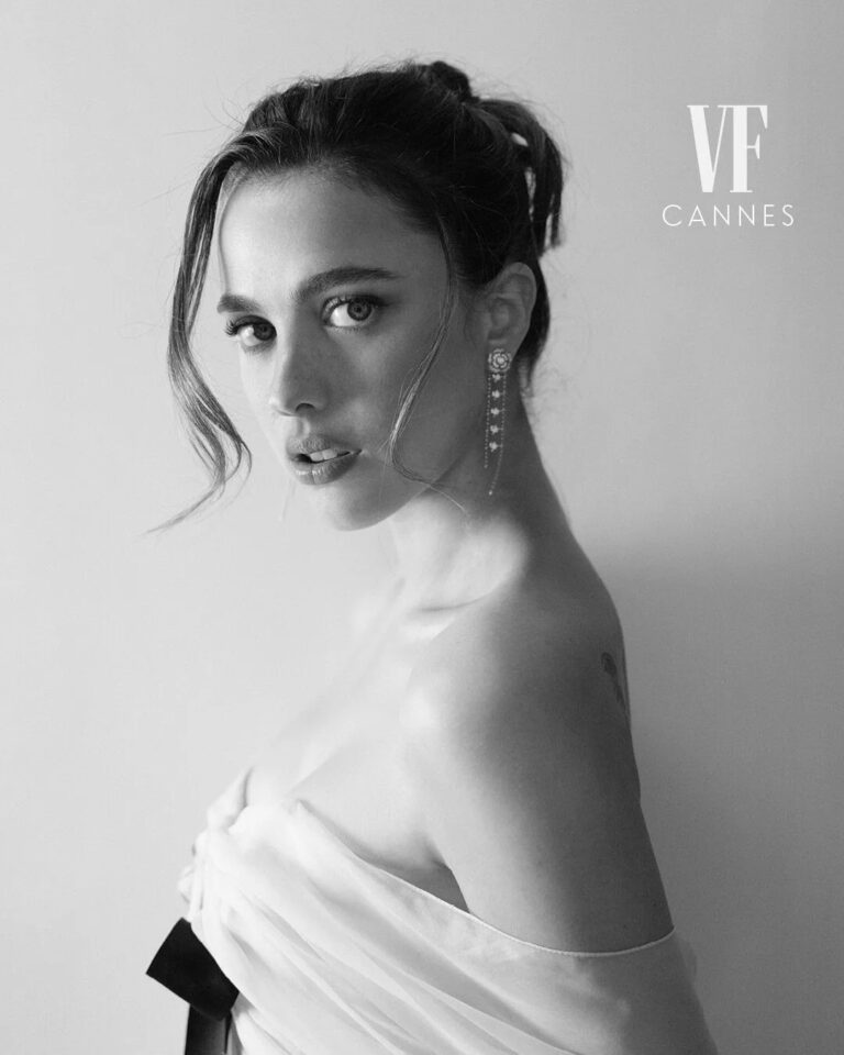 Margaret Qualley: Sporting an elegant updo with loose strands and eye-catching long…