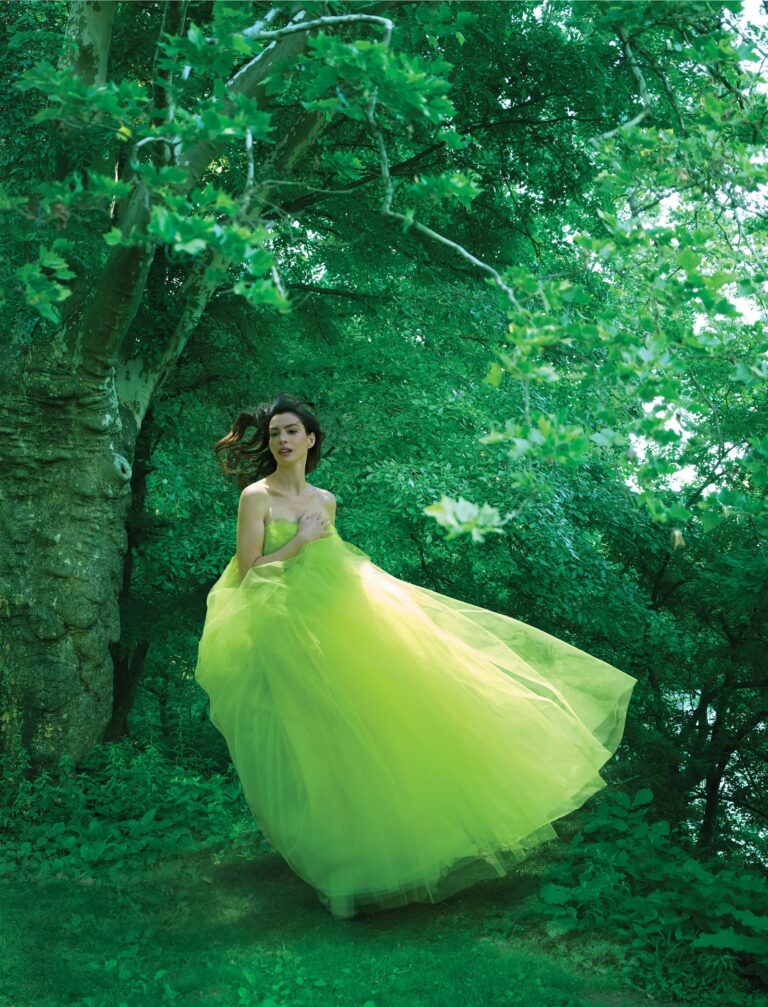 Anne Hathaway: In a long, airy yellow-green dress, she moves among the…