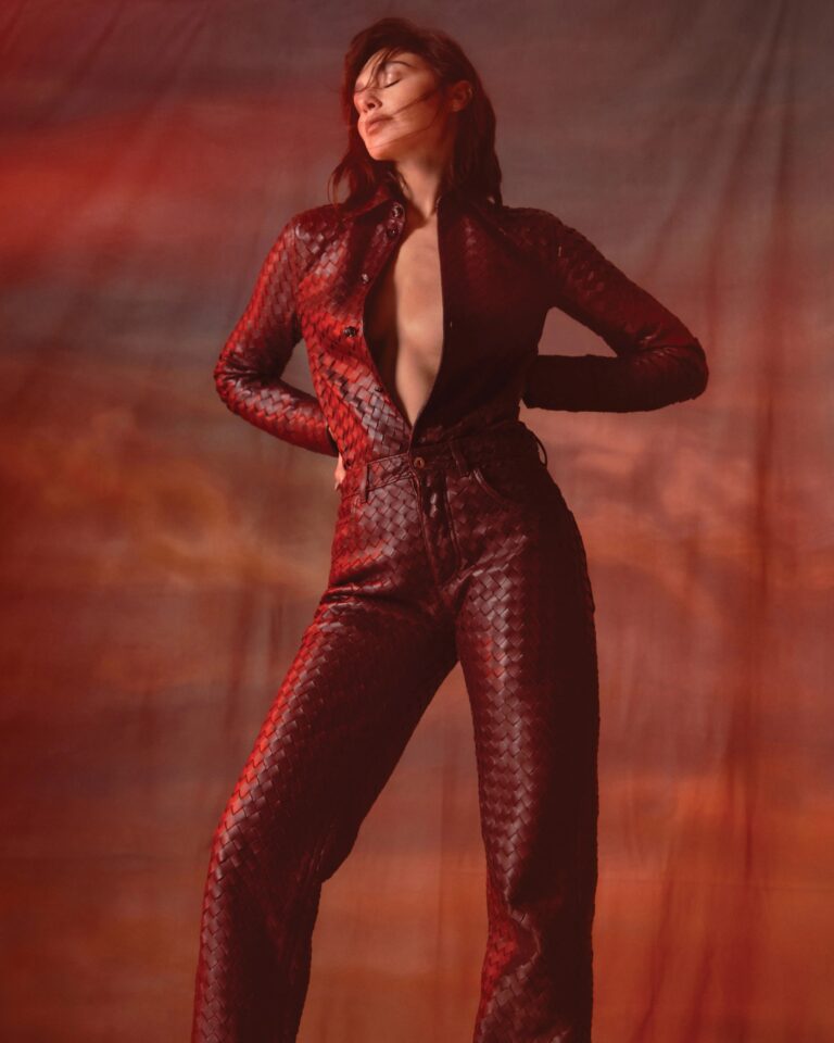 Gal Gadot: Wears a dark brown leather outfit with an interlaced pattern. The shirt is…