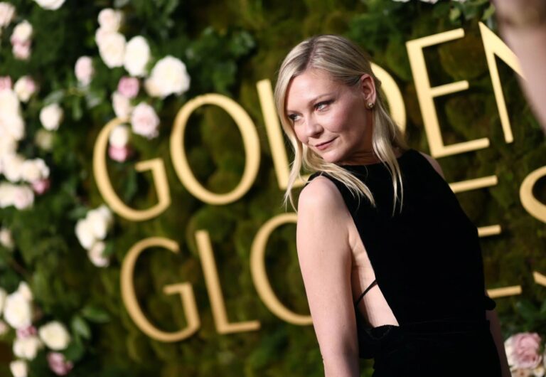 Kirsten Dunst: Wears a sleeveless black dress that leaves part of the back exposed.…