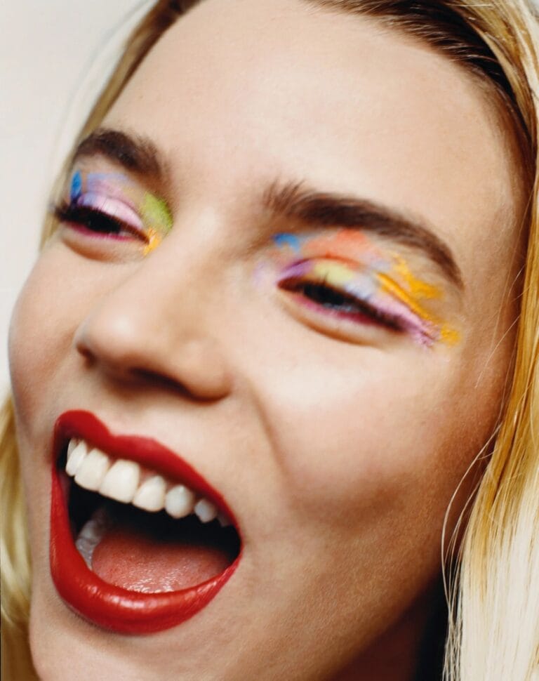 Anya Taylor-Joy: Wears vibrant makeup with pastel eyeshadow and a lipstick…