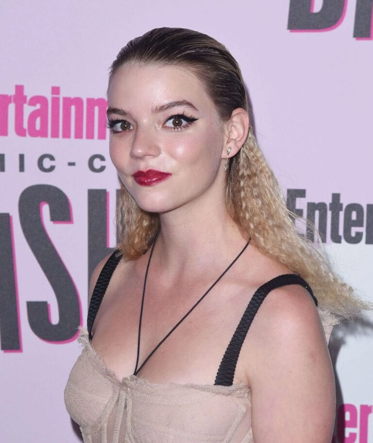 Anya Taylor-Joy: Wears a nude-toned top with thin straps, designed to highlight…
