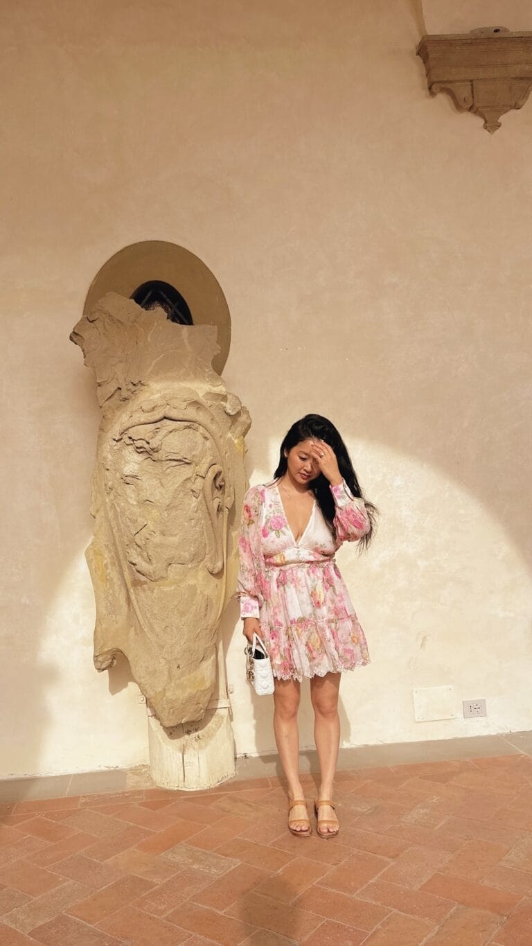 Lana Condor: Wears a floral dress in soft tones, with long sleeves and a V-neck…