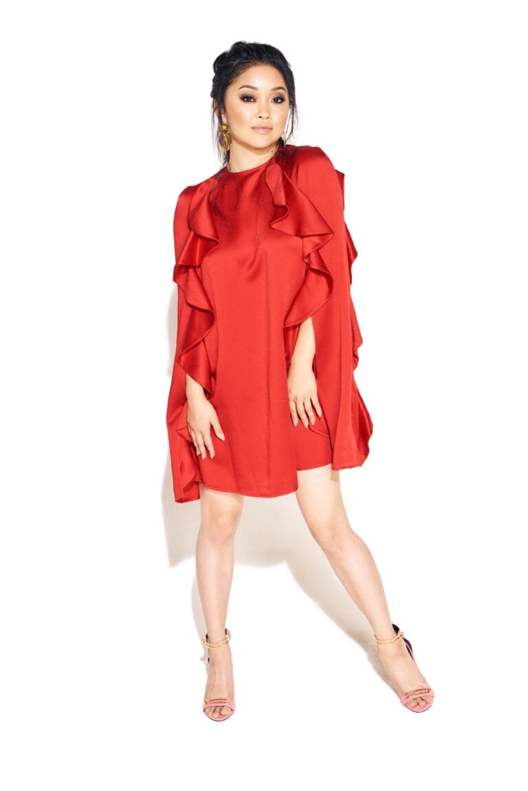 Lana Condor: Wears a red dress with cascading ruffles, highlighting its modern cut…