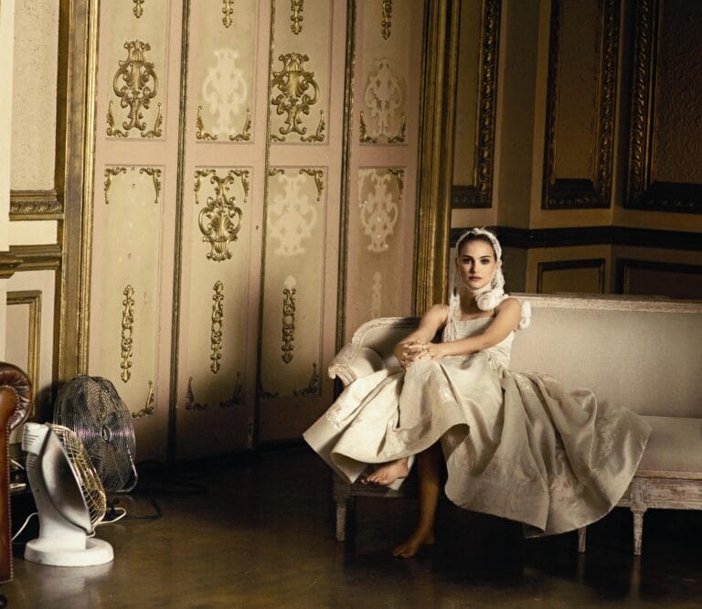 Natalie Portman: Wears a long satin gown in light tones, with an elegant, flowing silhouette…