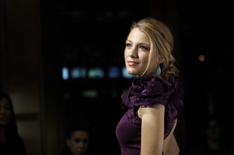 Blake Lively: Wears a purple dress with ruffle details, showcasing her elegance and sophistication in…