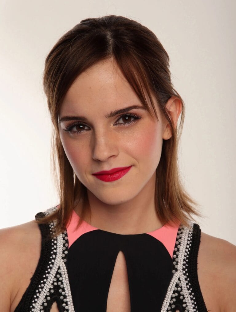 Emma Watson: Wears a black dress with pink details, adorned with sparkling pearls that…