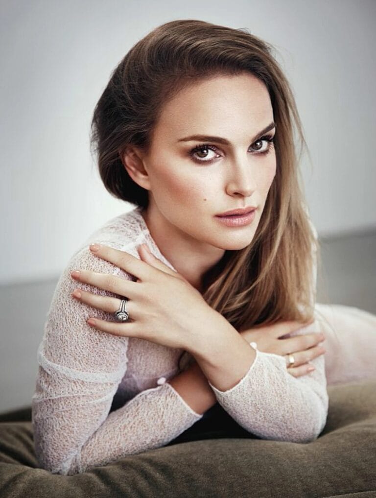 Natalie Portman: Wears a sheer blouse in light tones, reclining on a soft cushion…