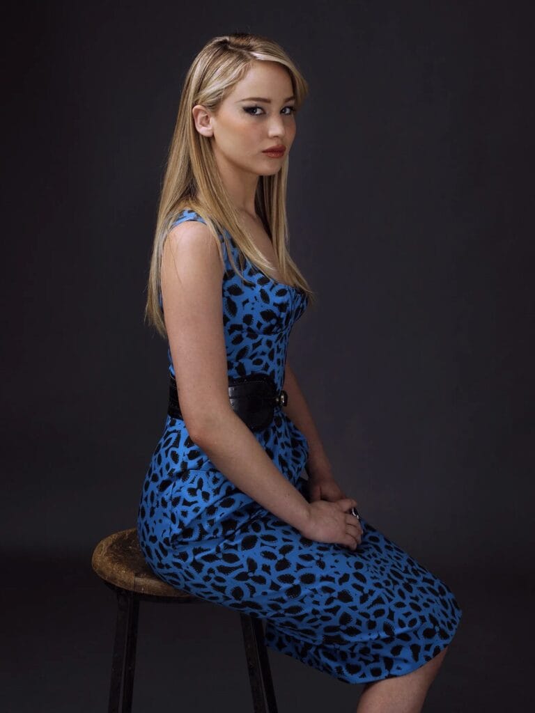 Jennifer Lawrence: Wears a blue leopard-print dress, fitted to her figure and tight…