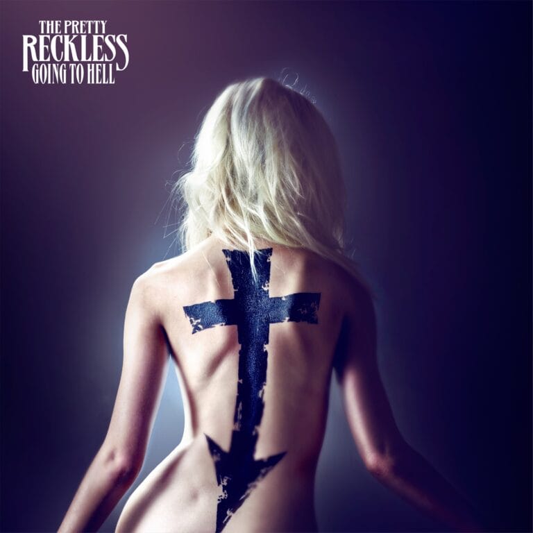 Taylor Momsen: Showing off a bold back design, with a large black cross and a…