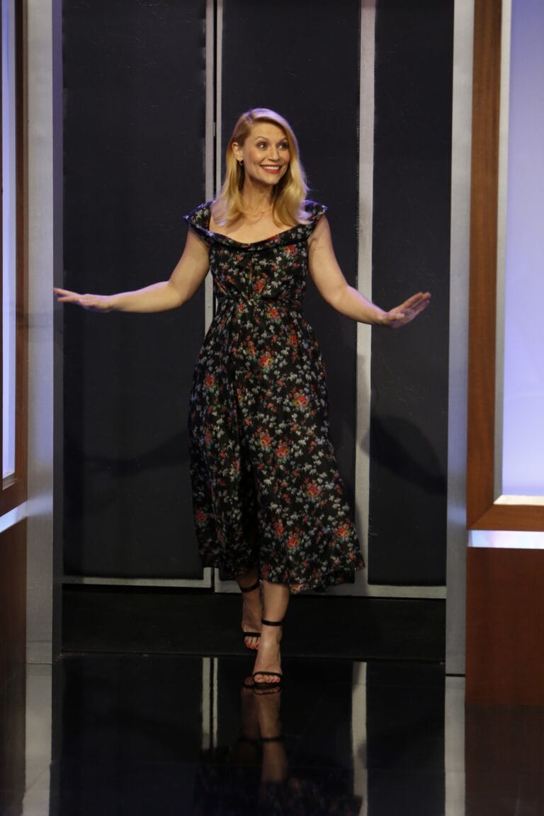 Claire Danes: Appears in a long floral dress in dark tones, with a wide neckline…