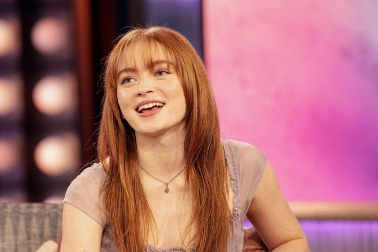 Sadie Sink: Wears a chiffon blouse in soft tones, with a subtle neckline that highlights…