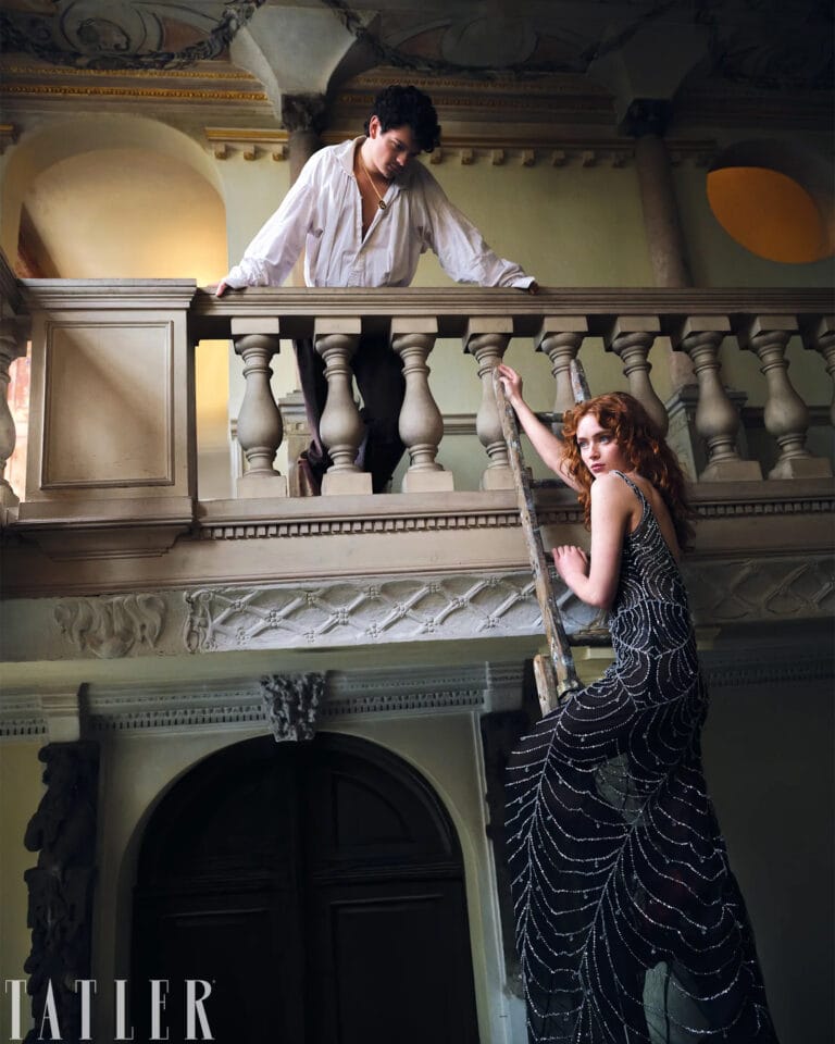 Sadie Sink: Wears a long, glossy black dress with delicate embroidery that evokes waves, while…