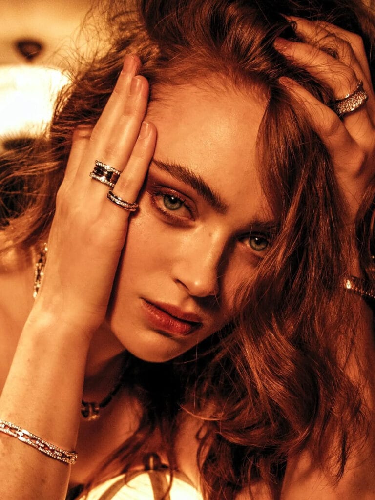 Sadie Sink: Wears a sophisticated look with sparkling jewelry that stands out against her skin. Is with…
