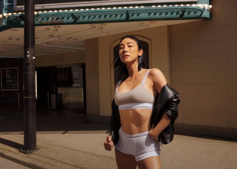 Greta Lee: Wears a minimalist look with a light gray bra and white shorts, both of…