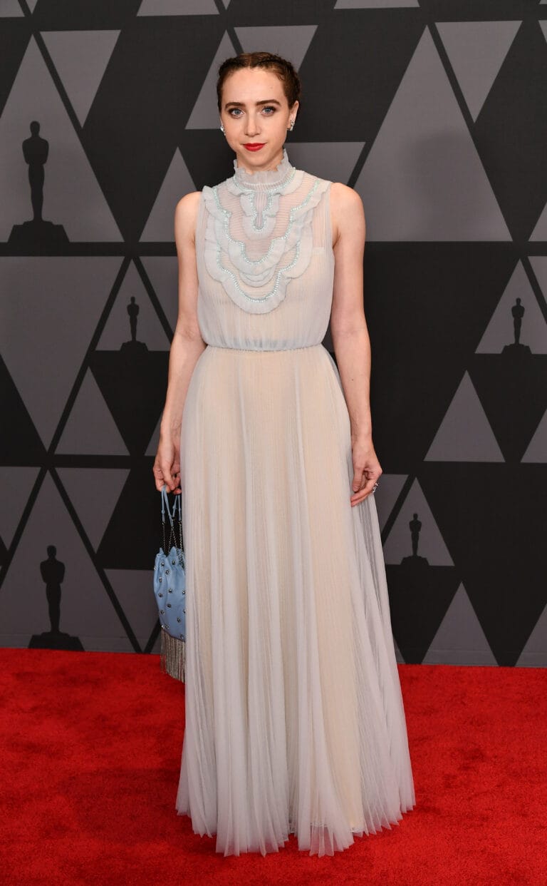 Zoe Kazan: Wears a long chiffon dress in soft tones, with lace details around…
