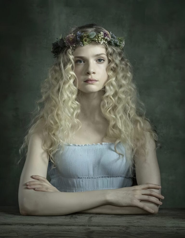 Elena Kampouris: Wearing a light blue sundress with a simple design that highlights…