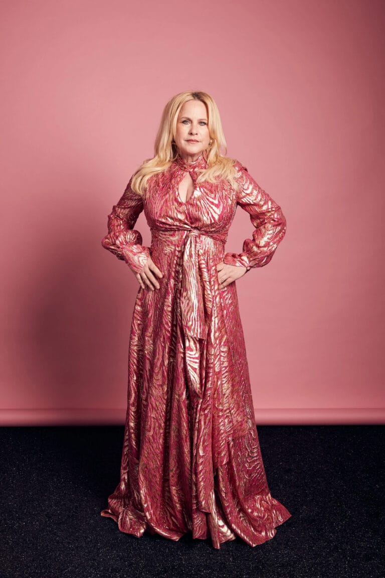 Patricia Arquette: Wearing a long satin gown in pink and gold tones with a design…