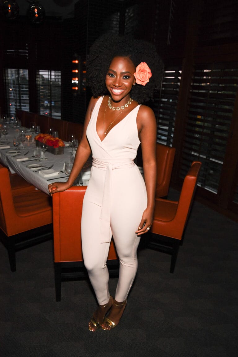 Teyonah Parris: Wears a fitted nude jumpsuit with a deep neckline that highlights her…