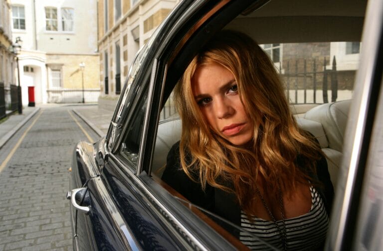 Billie Piper: Poses inside a classic car, with a casual look that includes…