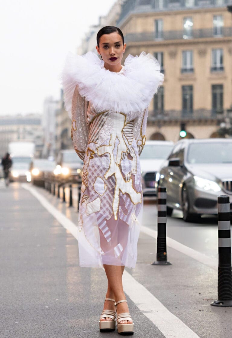 Amy Jackson: Wears a sheer dress with gold details and a voluminous white tulle collar,…