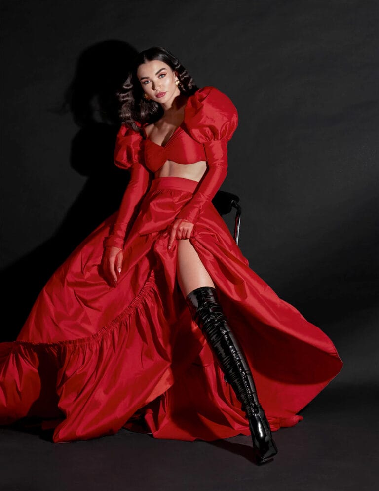 Amy Jackson: Stuns in a striking red ensemble with a corset bodice, puffed sleeves and a skirt…