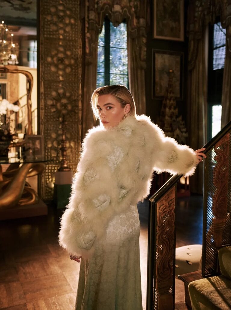 Florence Pugh: Wears a long white lace dress paired with a soft fur coat…