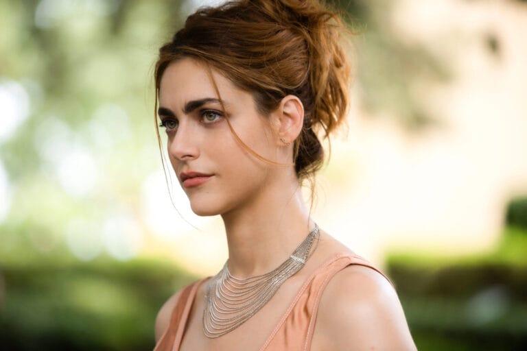 Miriam Leone: Wearing a soft pink top with thin straps, paired with a silver necklace of…