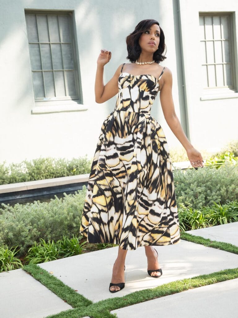 Kerry Washington: Wears a long dress with a yellow and black print, with a cut…